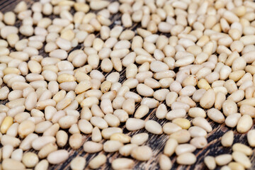 dried cedar nuts on a wooden table