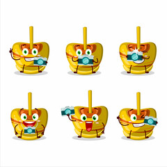 Photographer profession emoticon with yellow sugar candy cartoon character
