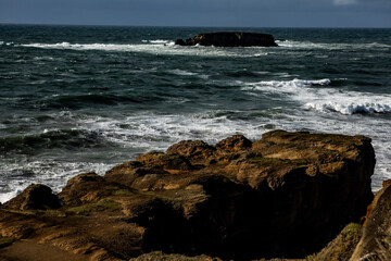 waves breaking on rocks