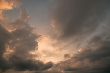 Heaven sky during sunset. Summer sky full of orange sunlight