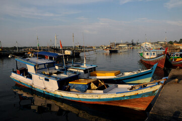 Fototapeta premium Traditional fishing boat docking on the jetty at Tanjung Binga, Belitung Island, Indonesia. 