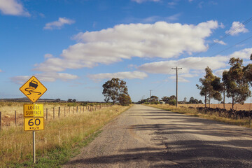 rough surface road sign in the countryside