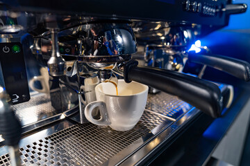 Close up view of barista making coffee. Professional coffeemaking machine.