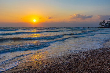 Fototapeta premium Beautiful sea waves in the morning sunrise.