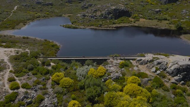 A drone pulls back from the Cov&atilde;o dos Conchos a manmade lake in the mountains of Portugal.