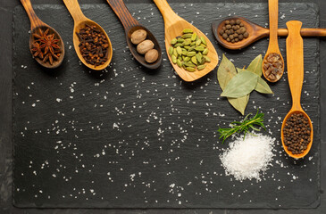 Spices selection over dark wooden table. Food or spicy cooking concept, Healthy eating Background.