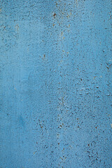 an old iron wall with old paint that has become dull and rusty due to time and weather conditions.  close-up.  can be used as a photo background