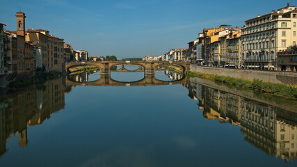 Fototapeta na wymiar View of the bridge Ponte Santa Trinita over the river Arno from Ponte Vecchio in Florence, Italy, Europe 