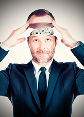 Conceptual image of a businessman showing gears in his head
