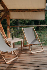 A bouquet of wildflowers with chairs on the terrace of a tent