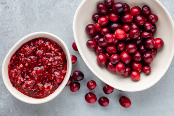 Red berries on a dark background. cranberries in a bowl.