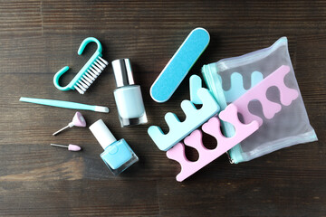 Concept of nail care with manicure accessories on wooden background