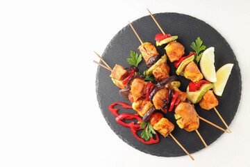 Concept of tasty food with chicken shashlik on white background