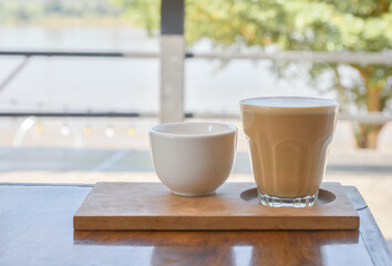 Coffee and tea on a wooden table.