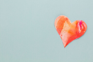 Cut the heart shaped paper, put on a pastel background.