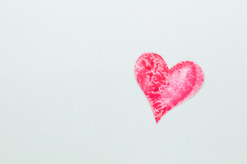 Cut the heart shaped paper, put on a pastel background.