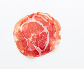 Italian prosciutto crudo or jamon. Raw ham. Isolated on white background.
