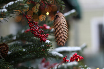 Obraz premium Happy New Year. Festive Christmas background. Christmas tree with Christmas lights covered in snow. Winter day in december
