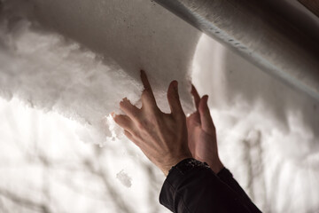 Winter time. Hands holding a snow ball.