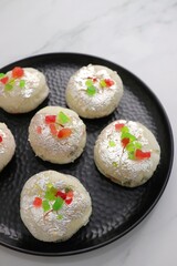 Rasmalai or Malai Sandwich, Roshmolai, Rasamalei is very popular Indian dessert. A sweet malai stuffing inside Rasgulla. It's a sweet delicacy made with Indian cottage cheese or chenna. Copy space.