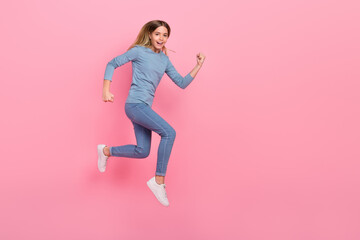 Fototapeta na wymiar Full body profile side photo of youth lady runner energetic speed rush motion jump isolated over pink color background