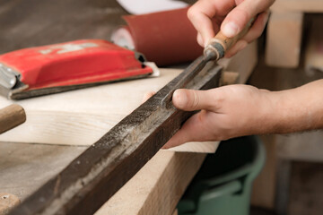 Man assembling furniture and fixing it - hobby garage concept.