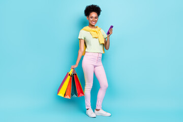 Full size photo of young african lady shop use cellphone boutique season isolated over blue color...