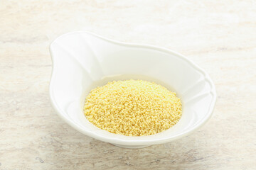 Raw couscous in the bowl