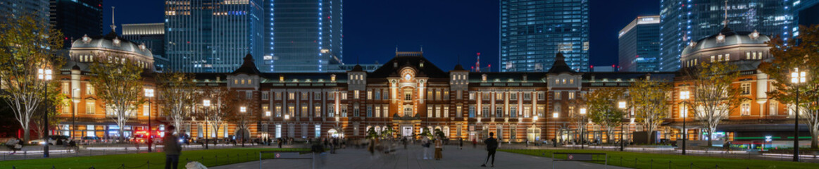 Fototapeta na wymiar Banner head image of Tokyo station and business buildings at Magic Hour 