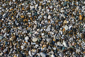 Wet sea pebbles. Pebbles on the sea