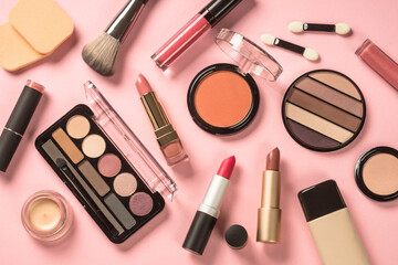 Beauty products. Make up products at pink background. Eye shadow, powder, lipstick for professional make up.