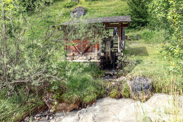 Old restored water mill in the park Mill Valley (Val di Morins). Longiaru, Italy