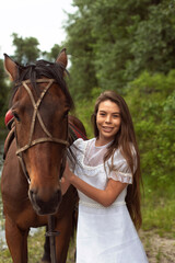 Fototapeta premium Walk with a horse near the river