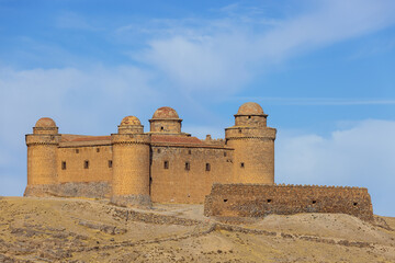 Naklejka premium Side view of La Calahorra Castle, seen from the limits of the village