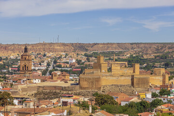 Fototapeta na wymiar Distant view of the Alcazaba and the Guadix Cathedral, seen from the Padre Poveda lookout