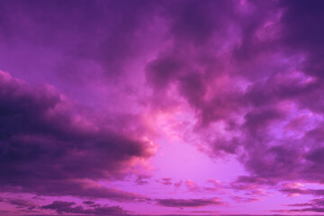 Fototapeta na wymiar Dramatic cloudy sky at sunset. Colored in trendy Velvet Violet color