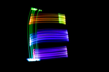 Letter E. Isolated figure on a black background. Freezelight.