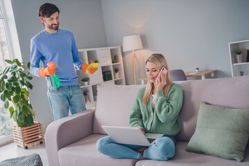 Portrait of two attractive cheerful people girl discussing business order guy making cleanup at home indoors