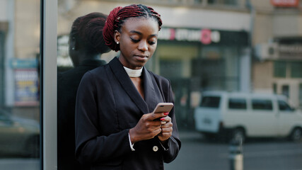 Serious confident professional specialist african american business woman young girl stands in city...