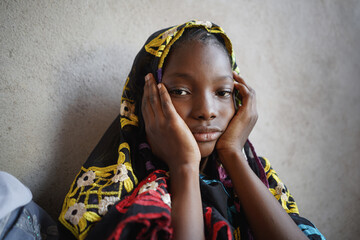 Portrait of Sad African girl looking to camera