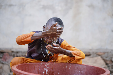 African boy uses fresh clean water