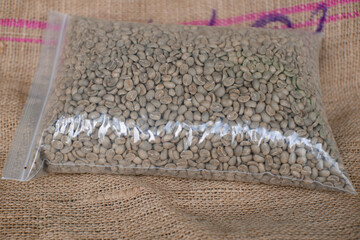 closeup of raw coffee beans in plastic. arabica coffee 