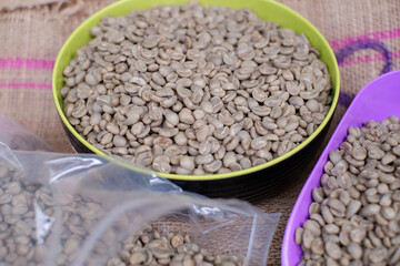 raw coffee beans or green beans. top view of coffee with fullwash method ready to be roasted 