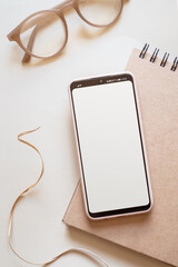 Online shopping smartphone and credit card flat lay beige background