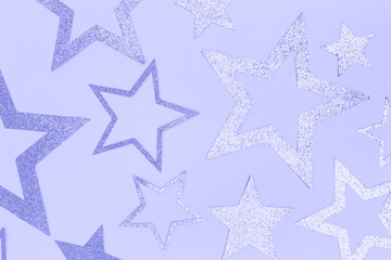 Glittering stars confetti. Monochrome composition in a purple colors. Festive concept.