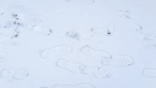 Footprints of shoe soles on a freshly fallen snow