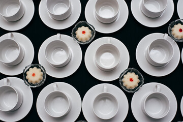 many coffee cups lined up and ready to receive guests