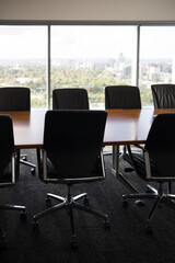 Meeting board room row chairs table window city corporate office 