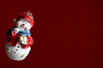 Happy snowman looking out the corner. Blank banner. Christmas greeting card, festive poster, invitation template