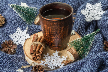 Black tea in ceramic cup with traditional New Year decoration